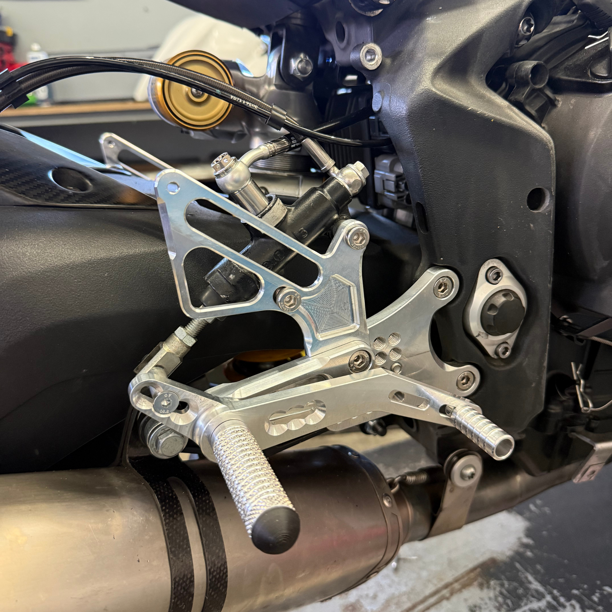 racing rearset assembly with brake and shift lever design for quick replacement and durability